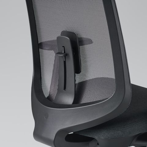 A close-up view of a Verus Chair with a black suspension back and adjustable lumbar support.