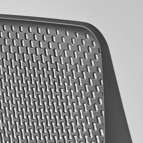A close-up view of a Verus Chair's black Triflex back.