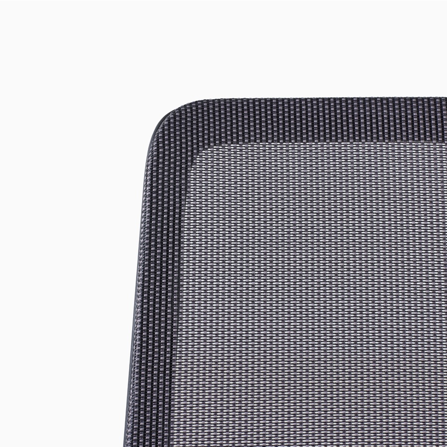 A close-up view of a Verus Chair's black suspension back.