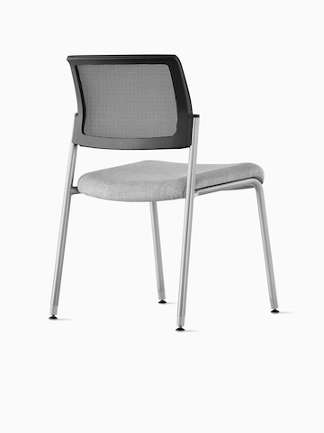 Back side view of a Verus Side Chair upholstered in grey with black suspension back.