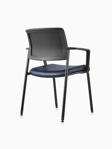Three-quarter view of a Black Verus Side Chair with arms in blue vinyl upholstery and black upholstered back.