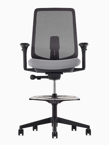 A black Verus Stool with a suspension back, grey seat and black frame viewed from the front.
