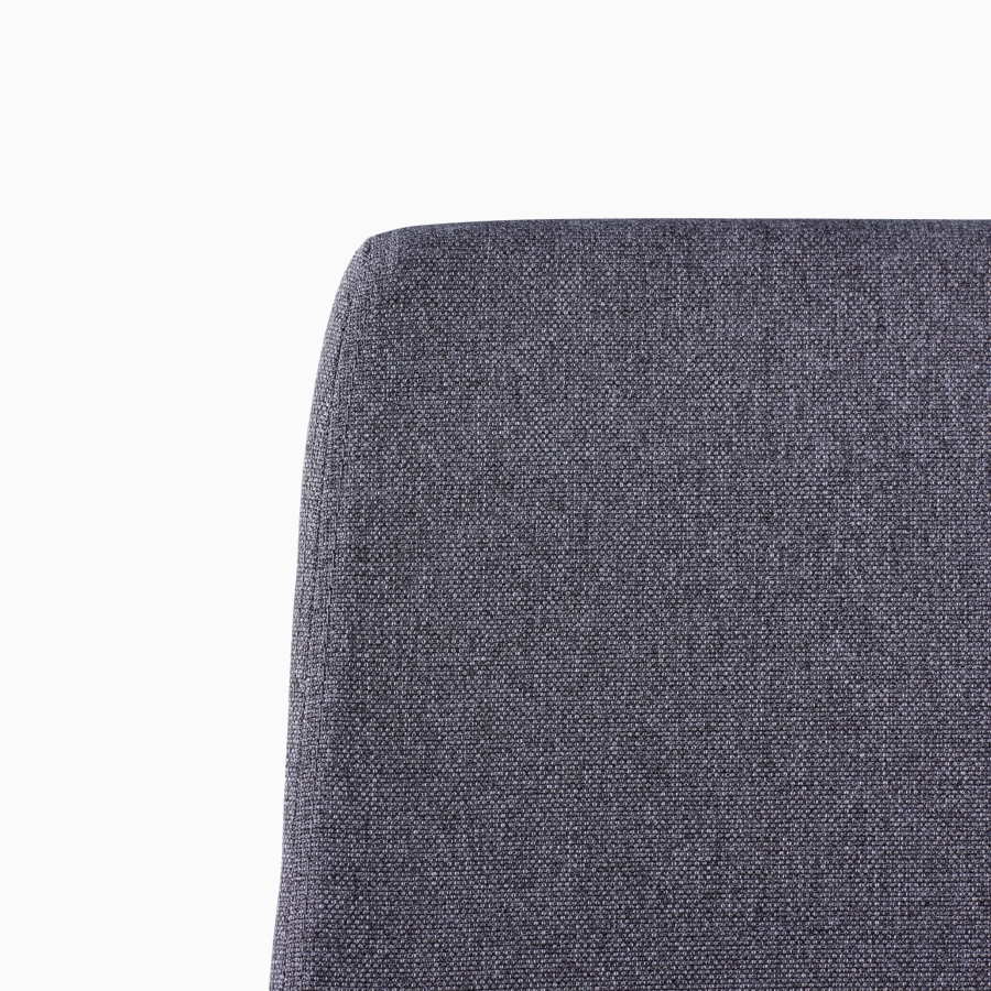 A close-up view of a Verus Stool's black upholstered back.