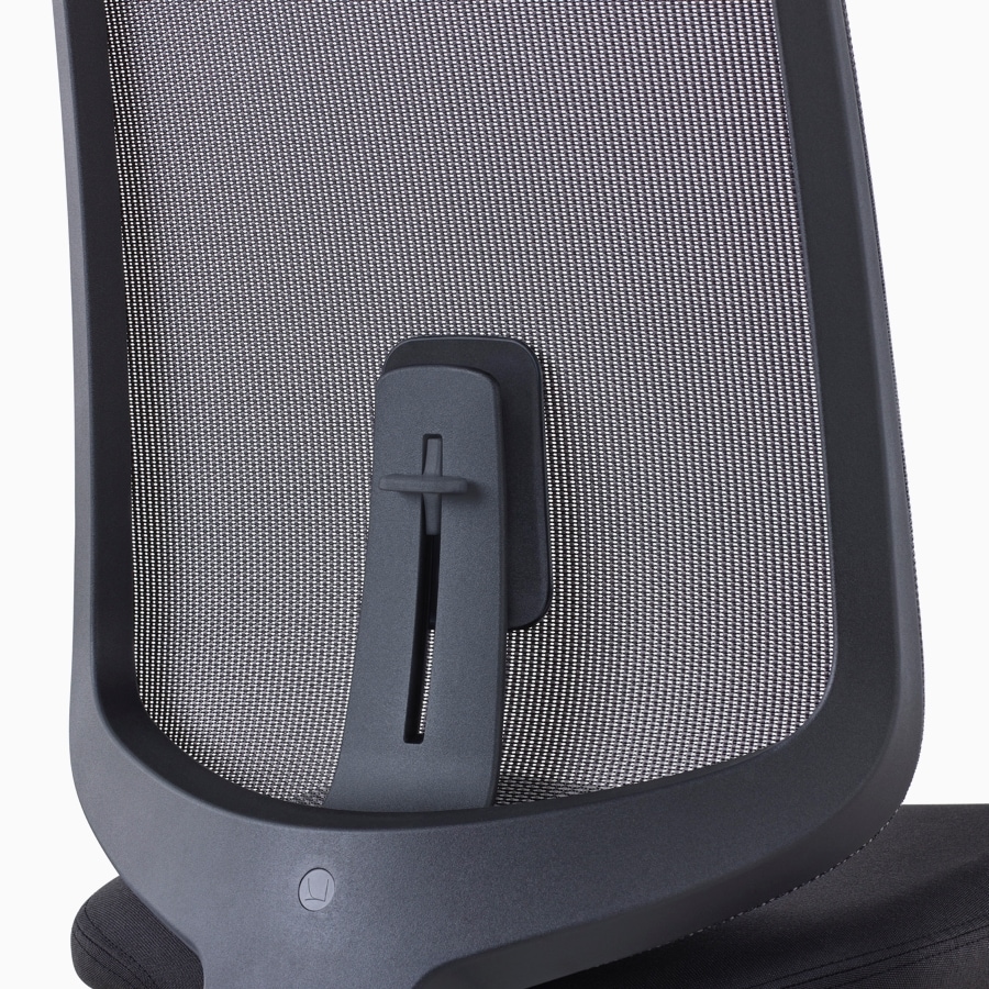 A close-up view of a Verus Stool's black suspension back with adjustable lumbar support.