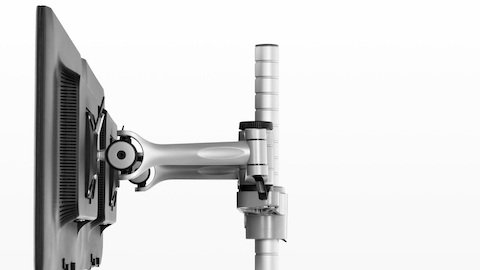 Profile view of a Wishbone Monitor Arm supporting multiple monitors.