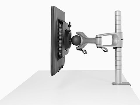Profile view of a single monitor attached to a Wishbone Monitor Arm post.