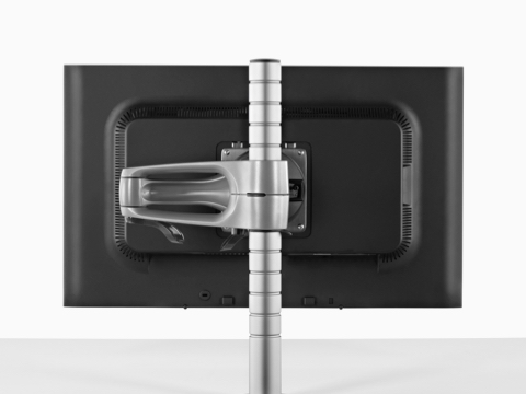 Vista traseira de um único monitor conectado a uma coluna do braço do monitor Wishbone.