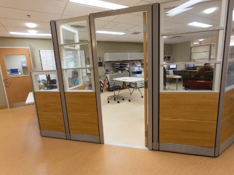 A separate work area inside of a room at a medical care facility. 