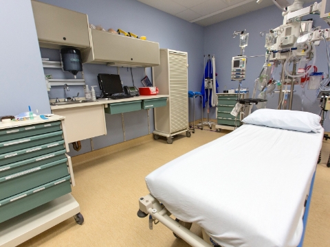 An empty hospital room outfitted with Co/Struc storage units. 