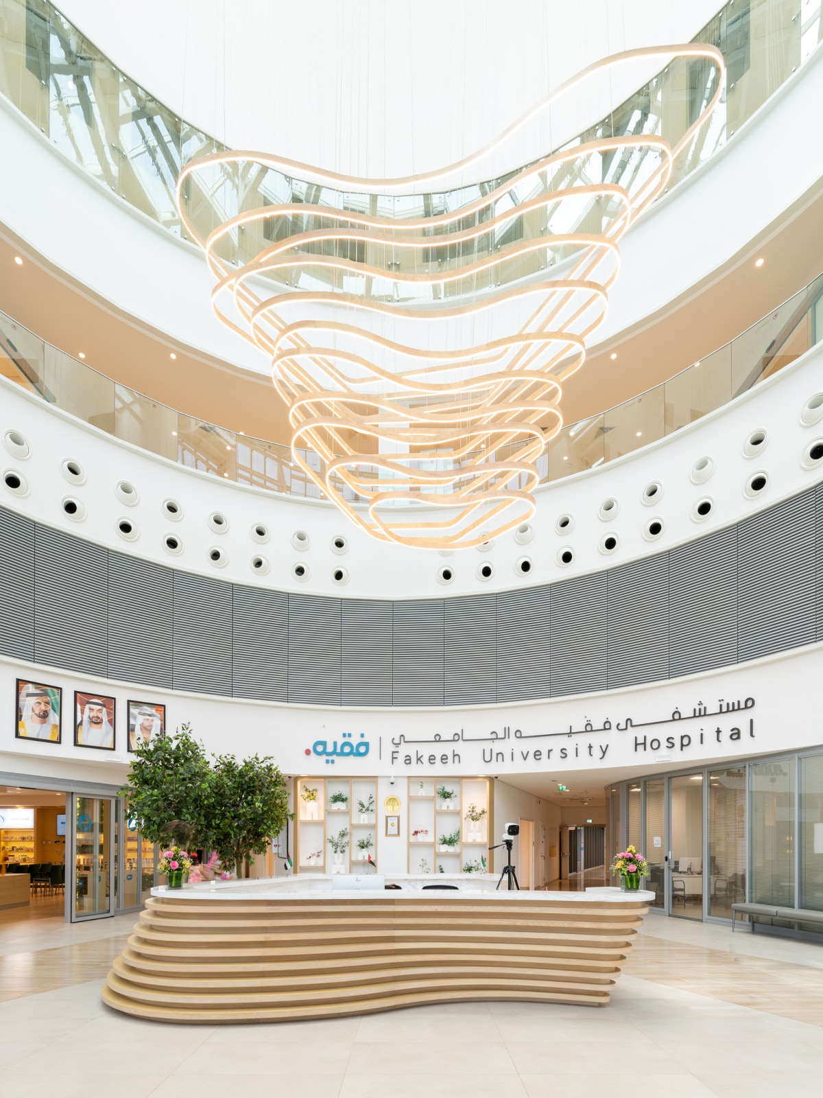 Atrium style lobby space with reception desk in foreground.