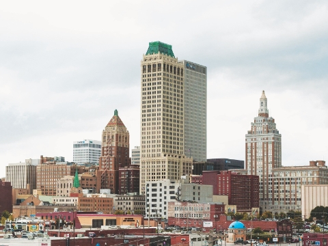 An outside view of the core of downtown Tulsa shows several tall buildings.