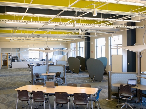 Intersect tables, Caper chairs, and Resolve workstations adorn a shared workspace. Intersect tables, Caper chairs, and Resolve workstations adorn a shared workspace.