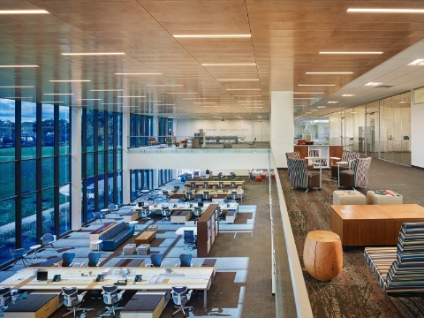 A second floor view of an open office space showing various seating arrangements. A second floor view of an open office space showing various seating arrangements.