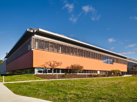 An outside view of an office building with modern architecture.