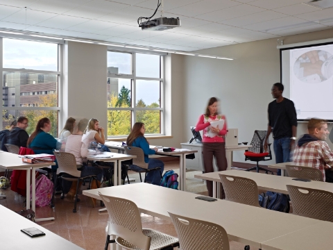 A classroom with students seated at Caper chairs and Everywhere tables. A classroom with students seated at Caper chairs and Everywhere tables.