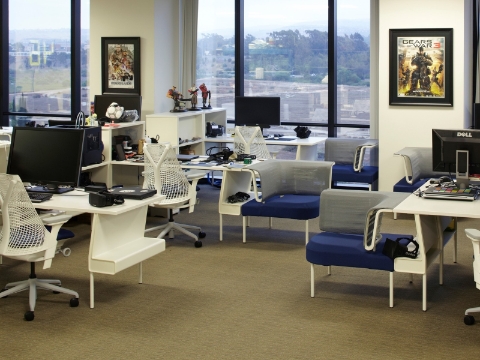 An open office setup full of Sayl chairs and Public Penninsula Group Settings.