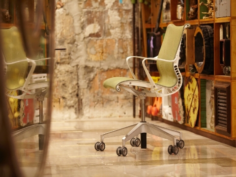 A Setu office chair sits empty inside a room. A Setu office chair sits empty inside a room.