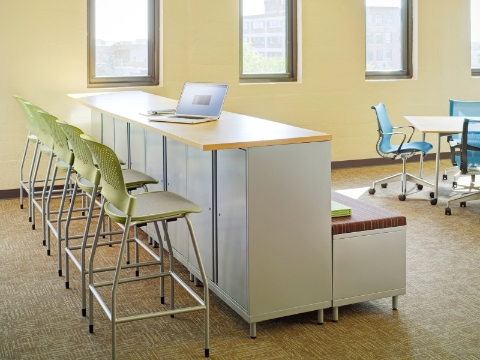 A classroom setting featuring both elevated and conventional seating options. 