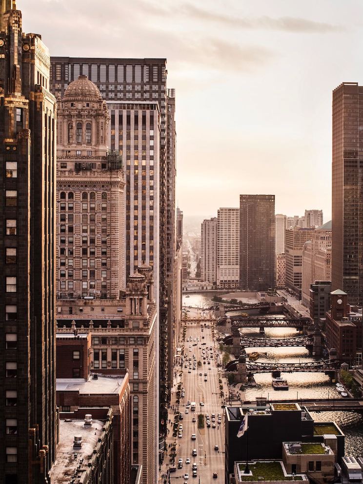 A rooftop view looking down a sprawling urban area. 