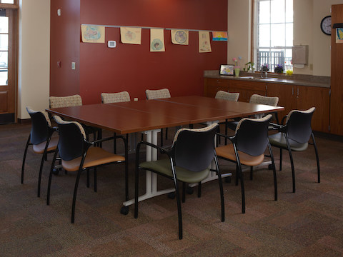 Aside chairs and Everywhere tables sit in the center of an arts and crafts room. 