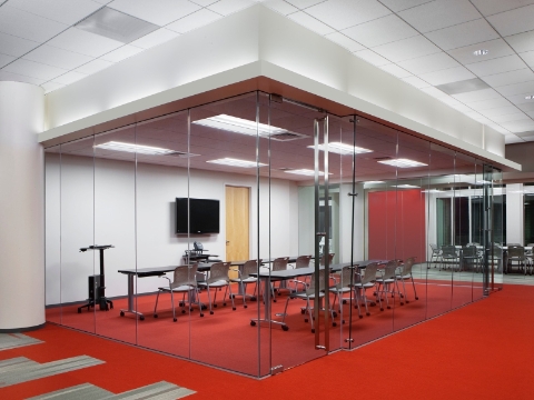 A meeting room with two rows of Caper Chairs and Everywhere tables. A meeting room with two rows of Caper Chairs and Everywhere tables.