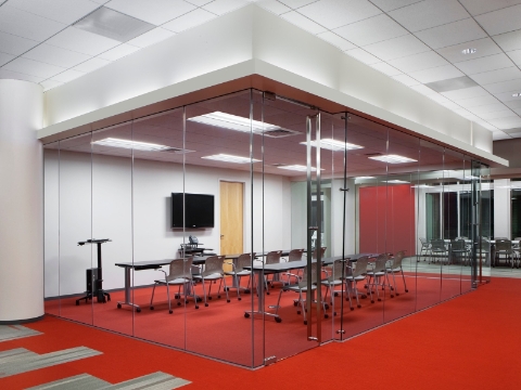 A meeting room with two rows of Caper Chairs and Everywhere tables. 