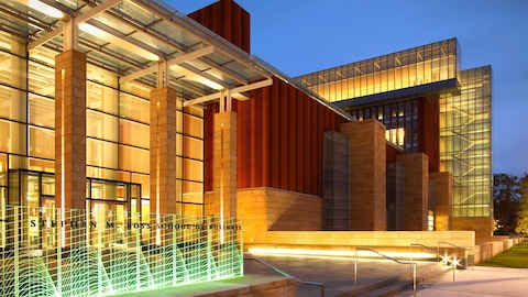 The exterior of the Ross School of Business on the University of Michigan campus at dusk.