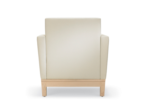 Back view of a Nemschoff Brava Platform Chair in a cream upholstery and a light wood finish base.