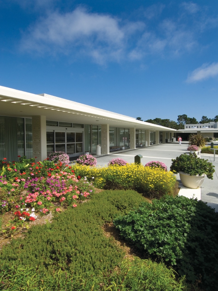 The main entrance of Community Hospital of the Monterey Peninsula is flanked by vibrant landscaping. 