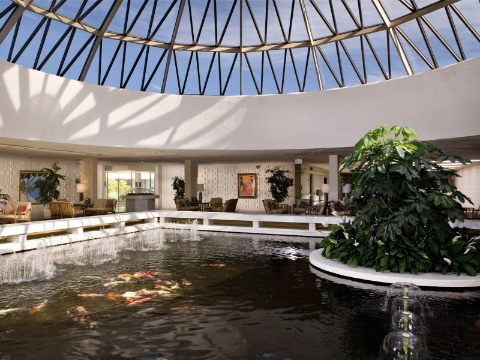 The lobby of the Community Hospital of the Monterey Peninsula features a large koi pond and abundant natural light. 