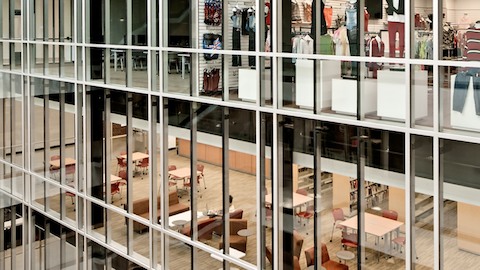 A student store and library, viewed through floor-to-ceiling windows. Select to read a case study about Florida State University. 