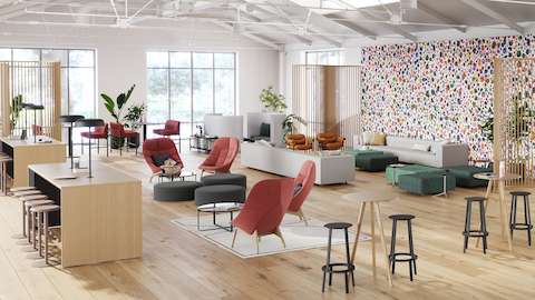 A vibrant public space designed to welcome people to the office and invite them to sit down, be comfortable, and reconnect with one another.