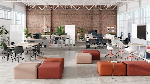 A workplace neighborhood for a high-energy creative team, featuring a variety of flexible work points punctuated by niches where quick collaborations can take place.