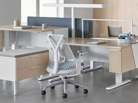 Canvas Vista benching application in the foreground and Canvas Vista desking application in the background, both with white and blue Sayl chairs. Canvas Vista benching application in the foreground and Canvas Vista desking application in the background, both with white and blue Sayl chairs.