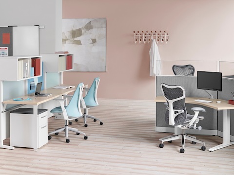 Light blue Sayl office chairs and gray Mirra 2 office chairs in a healthcare administrative area. 