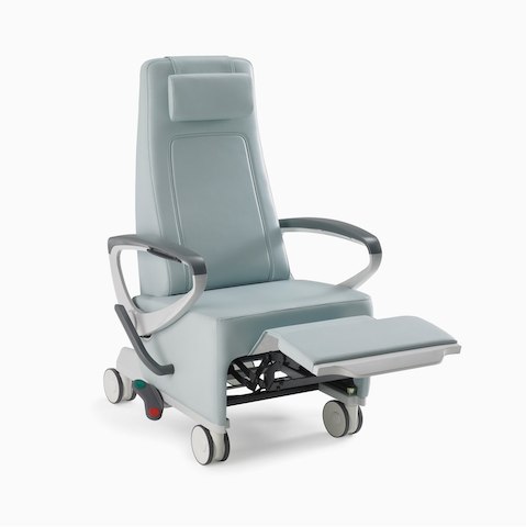 A light blue Ava Recliner with gray urethane arm caps, gray powder-coated aluminum arms, and an arcadeback style headrest.