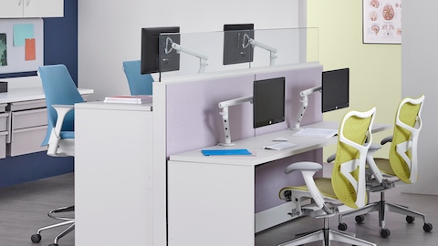 A healthcare laboratory featuring Co/Struc modular storage components, light blue Sayl Stools and green Mirra 2 Chairs.