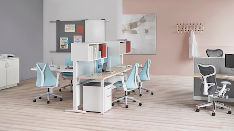 Light blue Sayl office chairs and gray Mirra 2 office chairs in a healthcare administrative area.