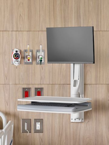 An Mbrace Wall-Mounted Technology with Compass System casework on a patient room headwall. An Mbrace Wall-Mounted Technology with Compass System casework on a patient room headwall.