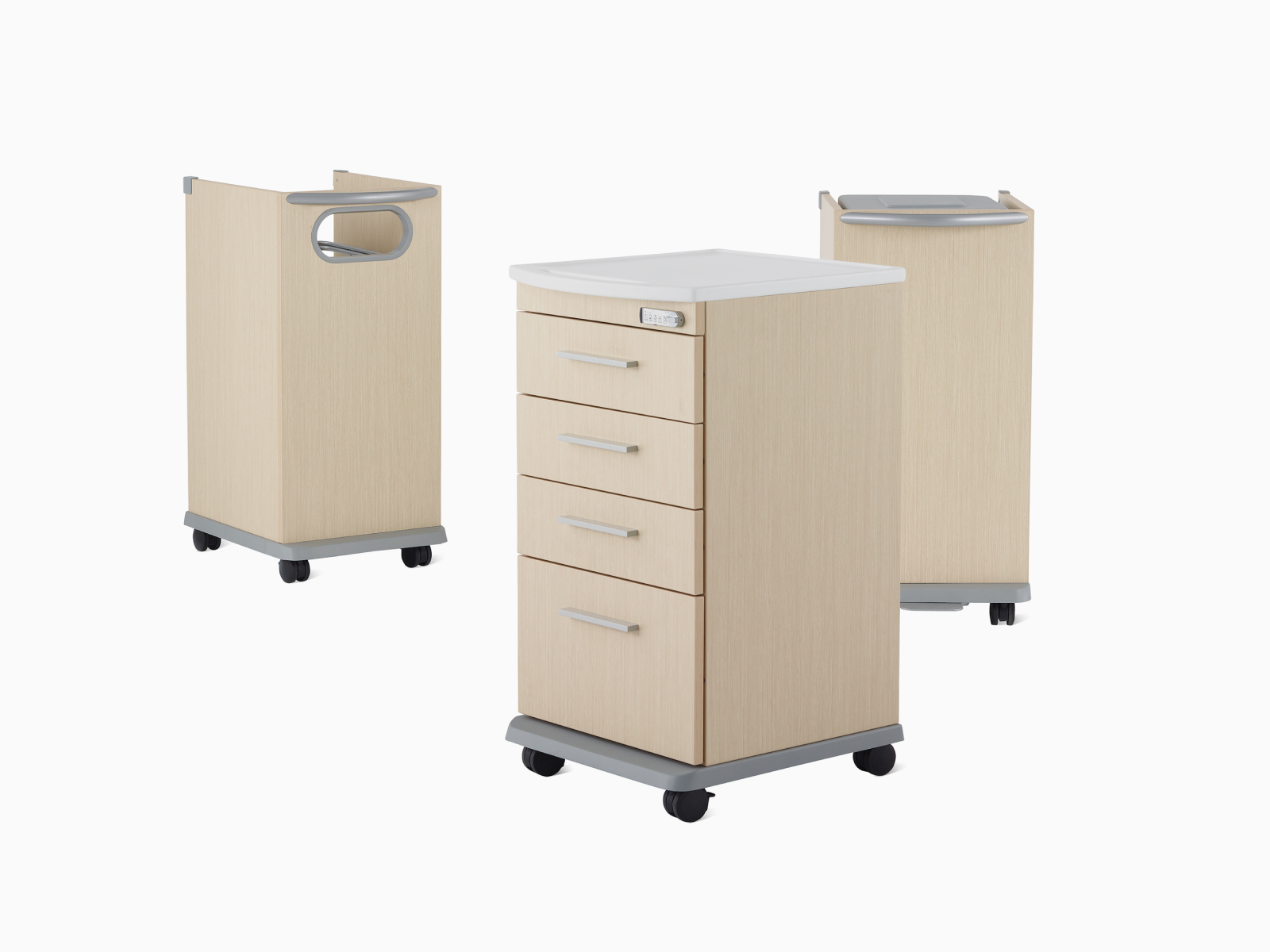 Three Mora casework carts, including a supply cart, linen cart, and trash cart in a light ash finish.