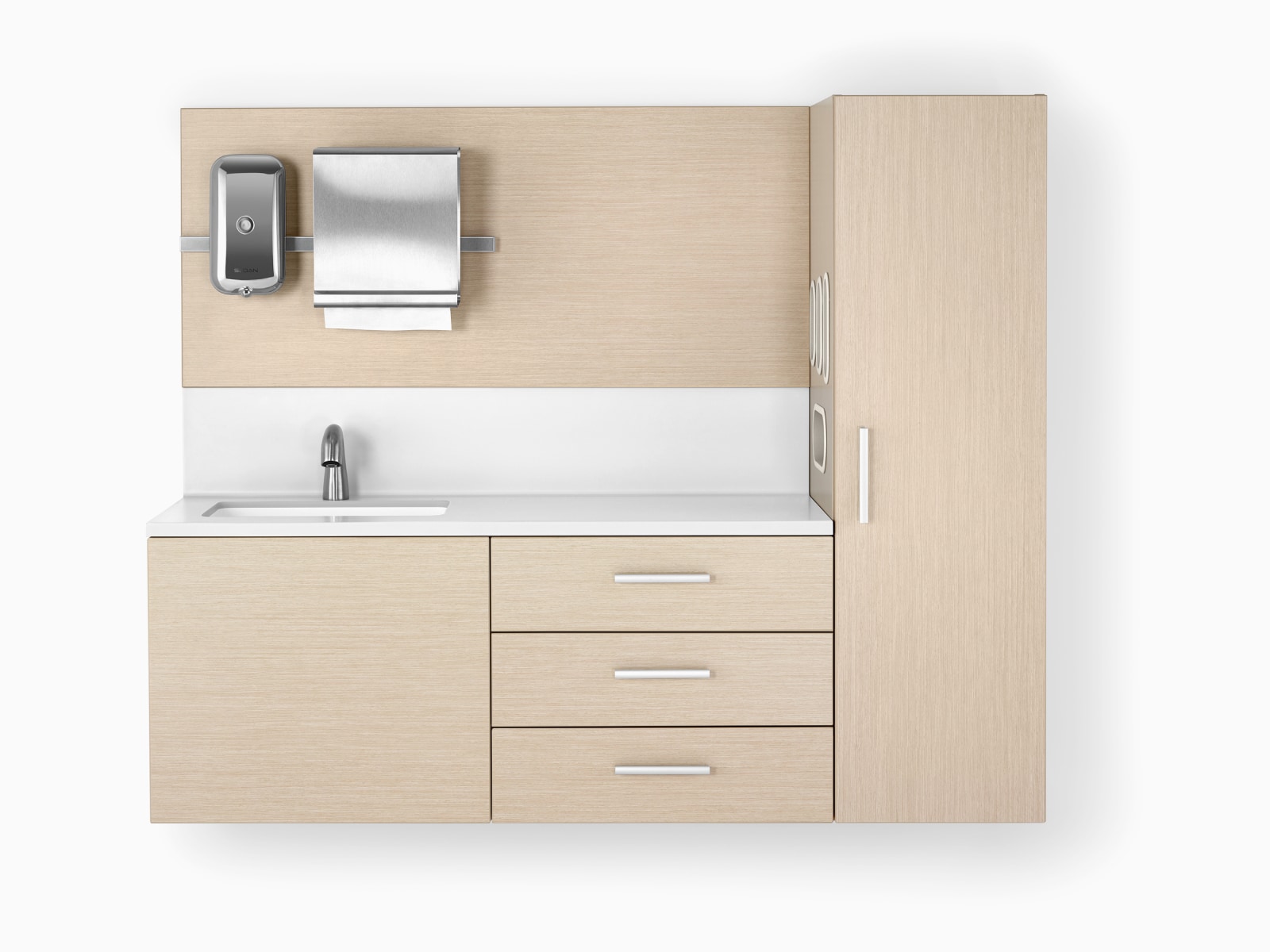 Mora casework in an ash finish and a white solid surface top and sink. The casework is wall-hung and has three drawers and one storage tower.