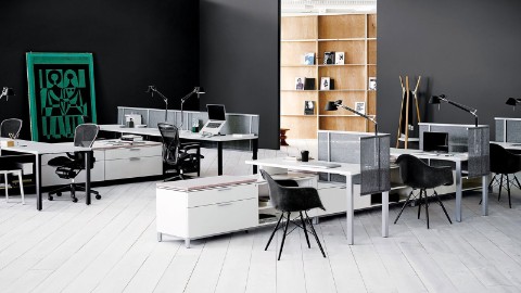 A Hive Setting outfitted with Canvas Office Landscape in white, with black Eames Shell chairs and black Aeron Chairs. A Hive Setting outfitted with Canvas Office Landscape in white, with black Eames Shell chairs and black Aeron Chairs.