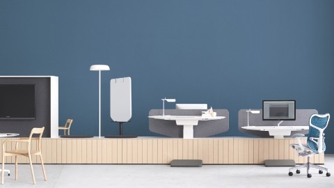 A series of Locale sit-to-stand desks with a blue Mirra 2 Chair. A series of Locale sit-to-stand desks with a blue Mirra 2 Chair.