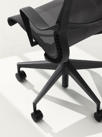 A black Setu office chair, viewed from overhead at a rear angle.