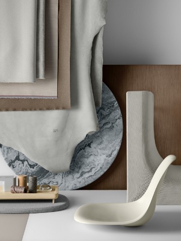 A materials palette featuring shades of gray and other neutrals.