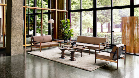 A waiting area featuring a Brabo Lounge Seating settee, sofa, and chair. Select to go to a WHY Magazine interview with designer Vincent Van Duysen.
