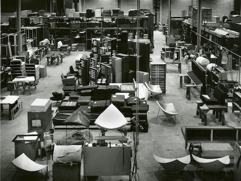 Herman Miller's upholstery department from 1956, showing multiple Coconut Lounge Chairs and other furniture in varying stages of production.