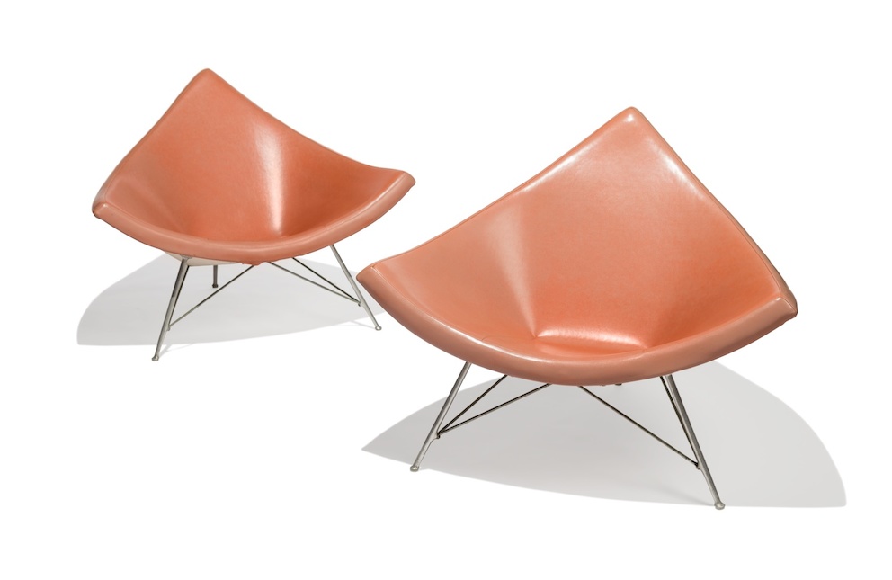 A pair of orange-pink Coconut Lounge Chairs designed by George Nelson's office and manufactured by Herman Miller. 