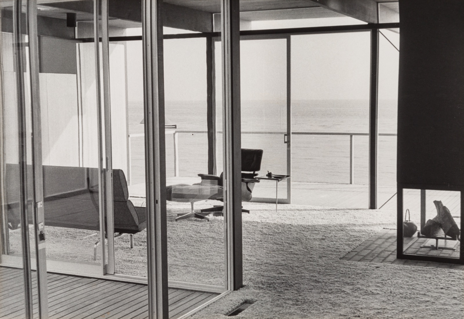 Interior view of Craig Ellwood's Hunt House looking out on the beach in Malibu, California.