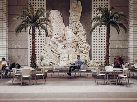 Student Thelonious Goupil reads at a public space on Wall Street. Student Thelonious Goupil reads at a public space on Wall Street.